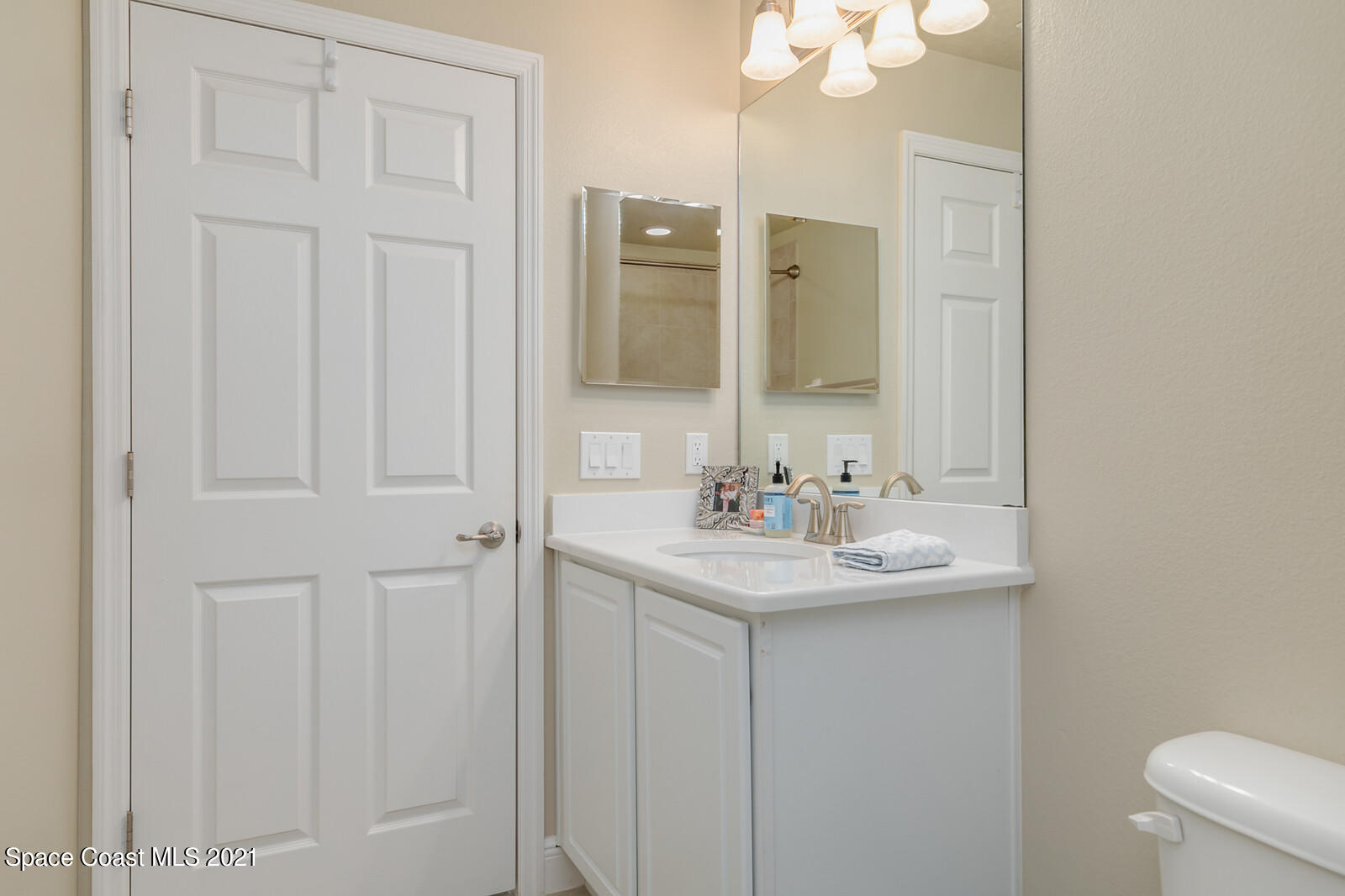 1398 Outrigger Circle Rockledge, FL 32955 - Photo 25 of 51 a bathroom with a sink and a mirror