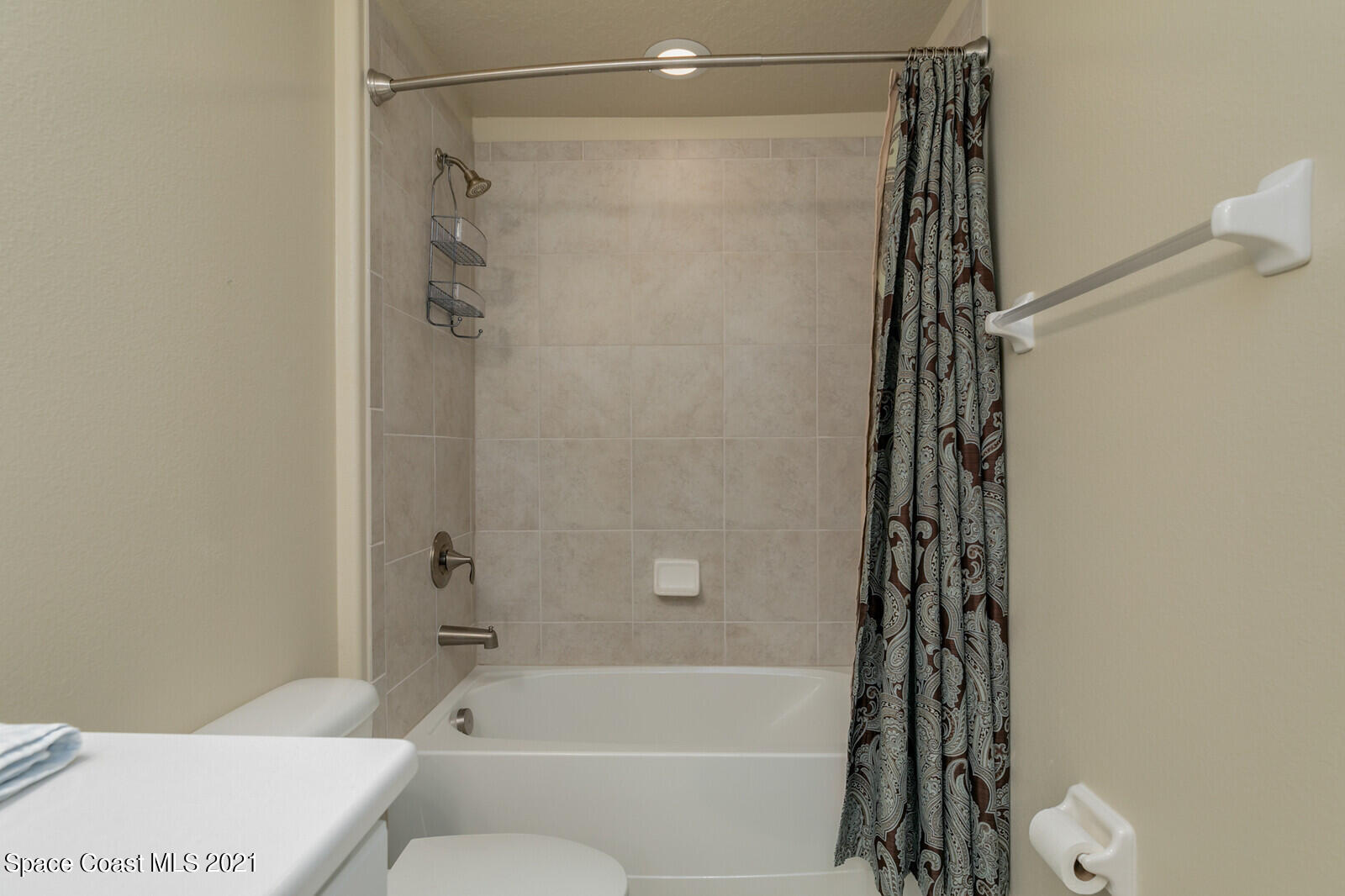 1398 Outrigger Circle Rockledge, FL 32955 - Photo 26 of 51 a bathroom with a shower curtain and a toilet
