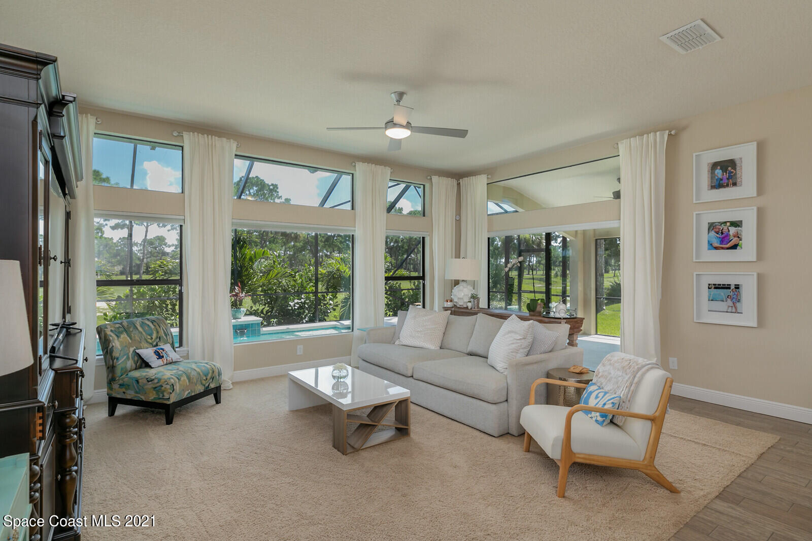 1398 Outrigger Circle Rockledge, FL 32955 - Photo 37 of 51 a living room with furniture and a large window