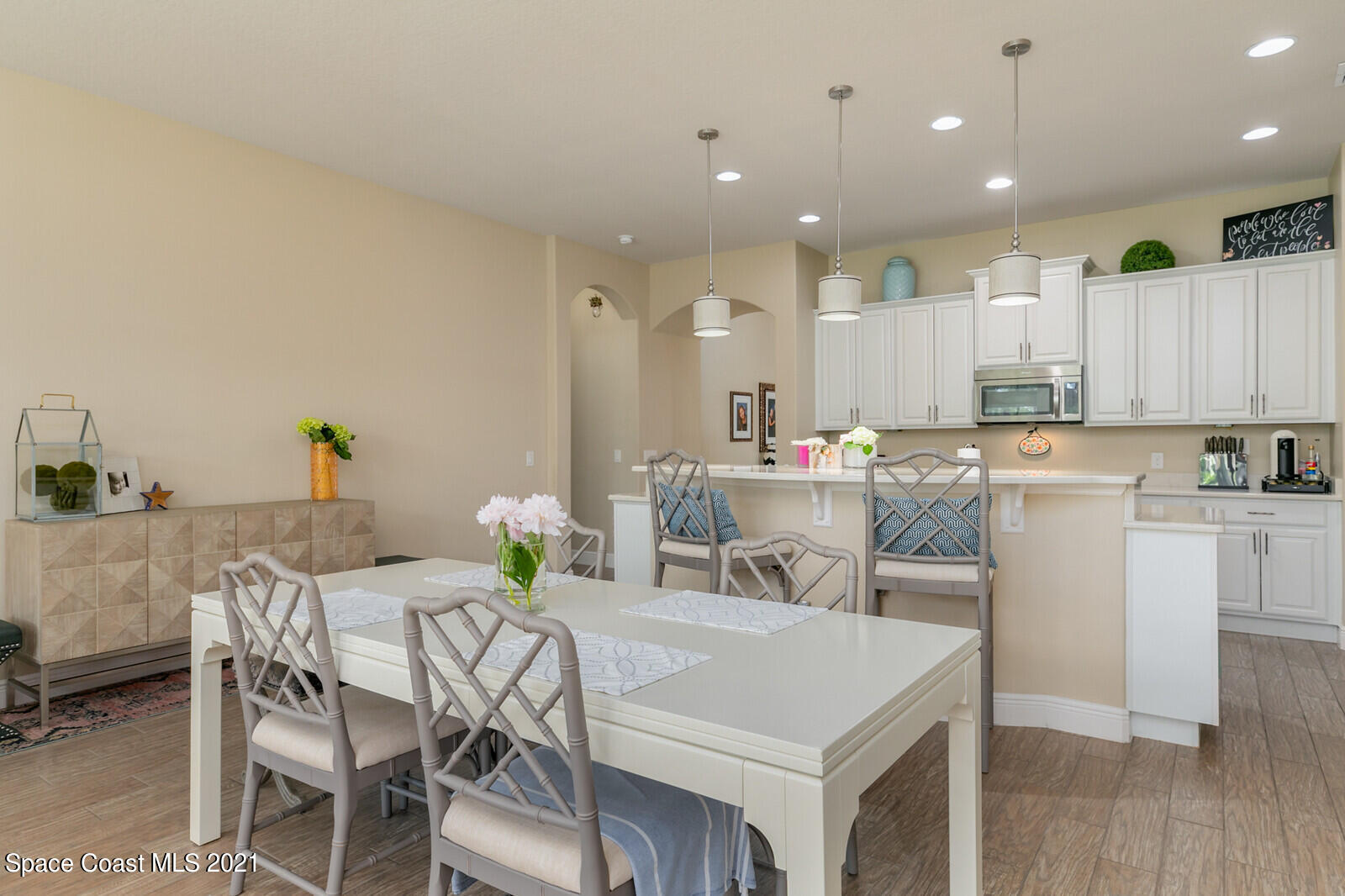 1398 Outrigger Circle Rockledge, FL 32955 - Photo 38 of 51 a view of a dining room with furniture and wooden floor