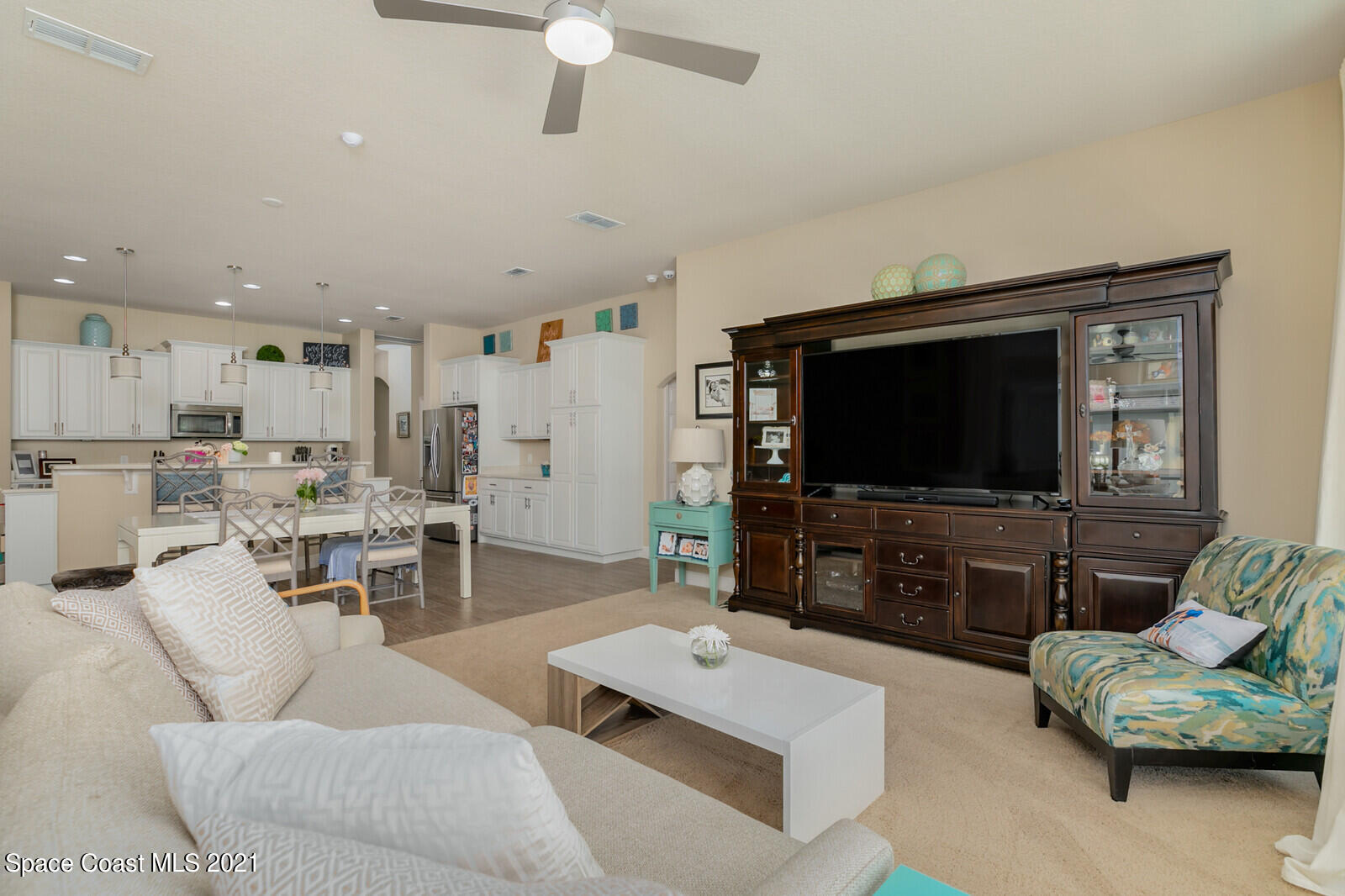 1398 Outrigger Circle Rockledge, FL 32955 - Photo 39 of 51 a living room with furniture and a flat screen tv