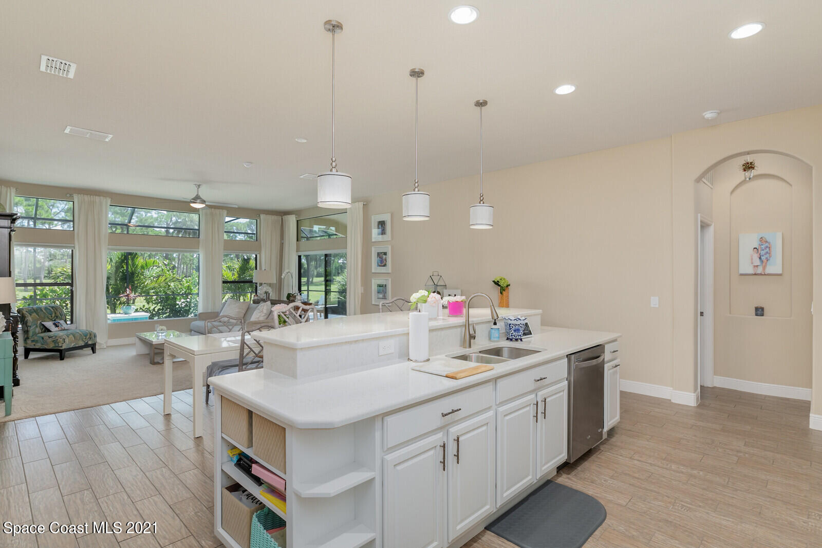 1398 Outrigger Circle Rockledge, FL 32955 - Photo 41 of 51 a kitchen with sink stove and living room