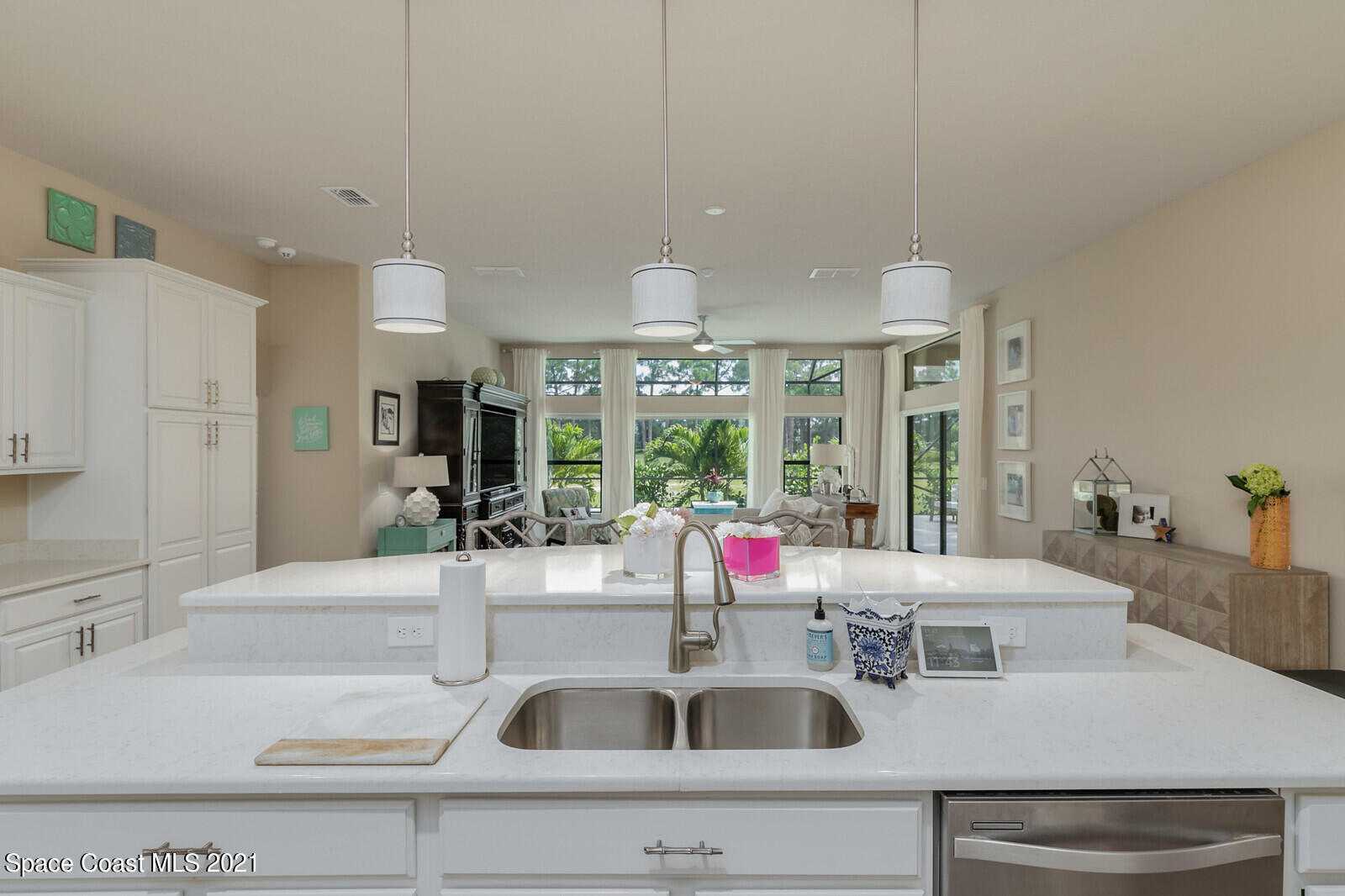 1398 Outrigger Circle Rockledge, FL 32955 - Photo 42 of 51 a kitchen with a sink and white cabinets