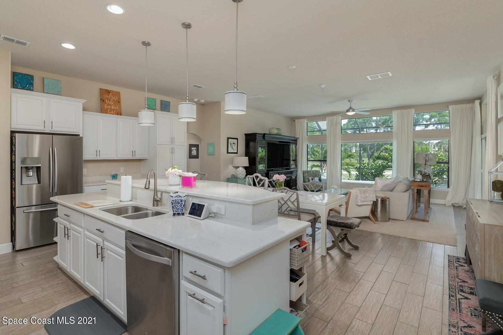 1398 Outrigger Circle Rockledge, FL 32955 - Photo 43 of 51 a kitchen with stainless steel appliances kitchen island granite countertop a sink and a refrigerator