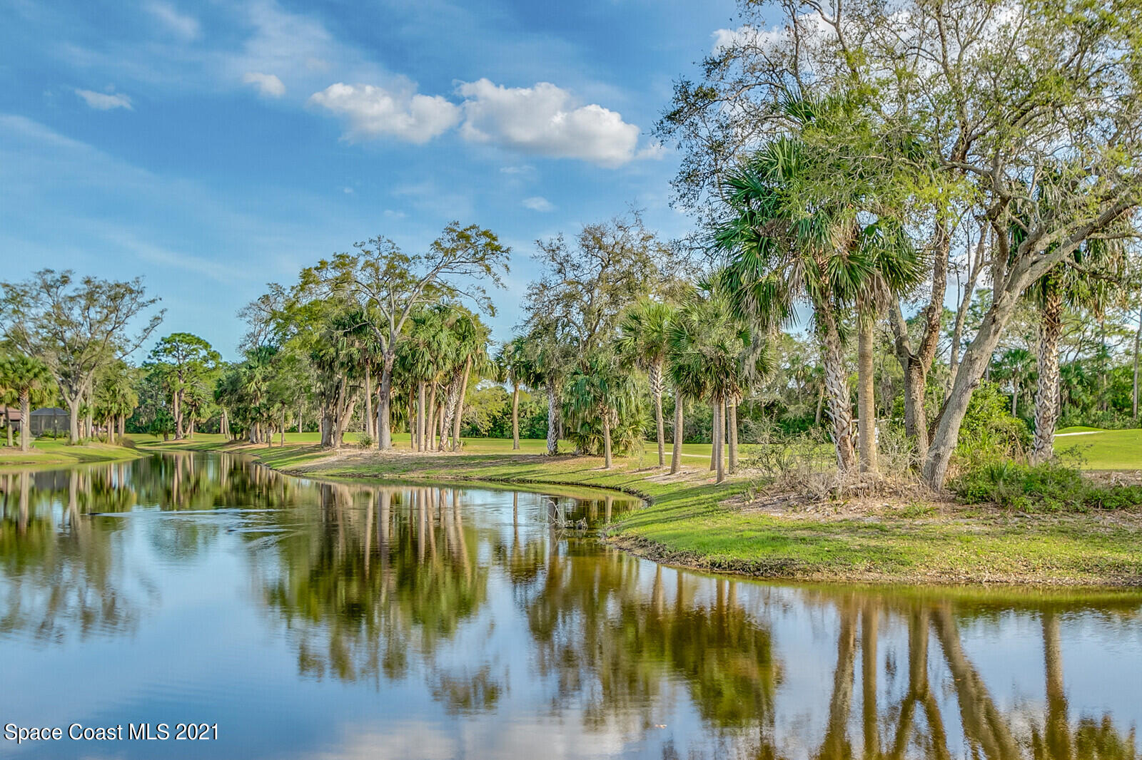 1398 Outrigger Circle Rockledge, FL 32955 - Photo 49 of 51 a view of a lake with a yard
