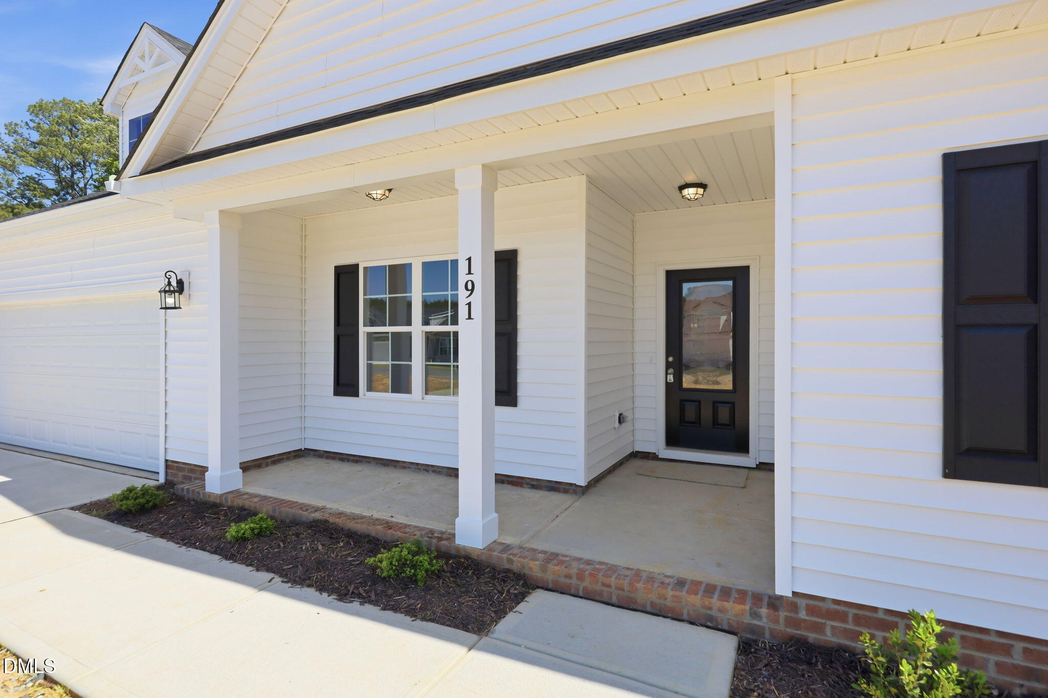 191 Nectar Lane Bunnlevel, NC 28323 - Photo 27 of 35 a front view of a house with a garden