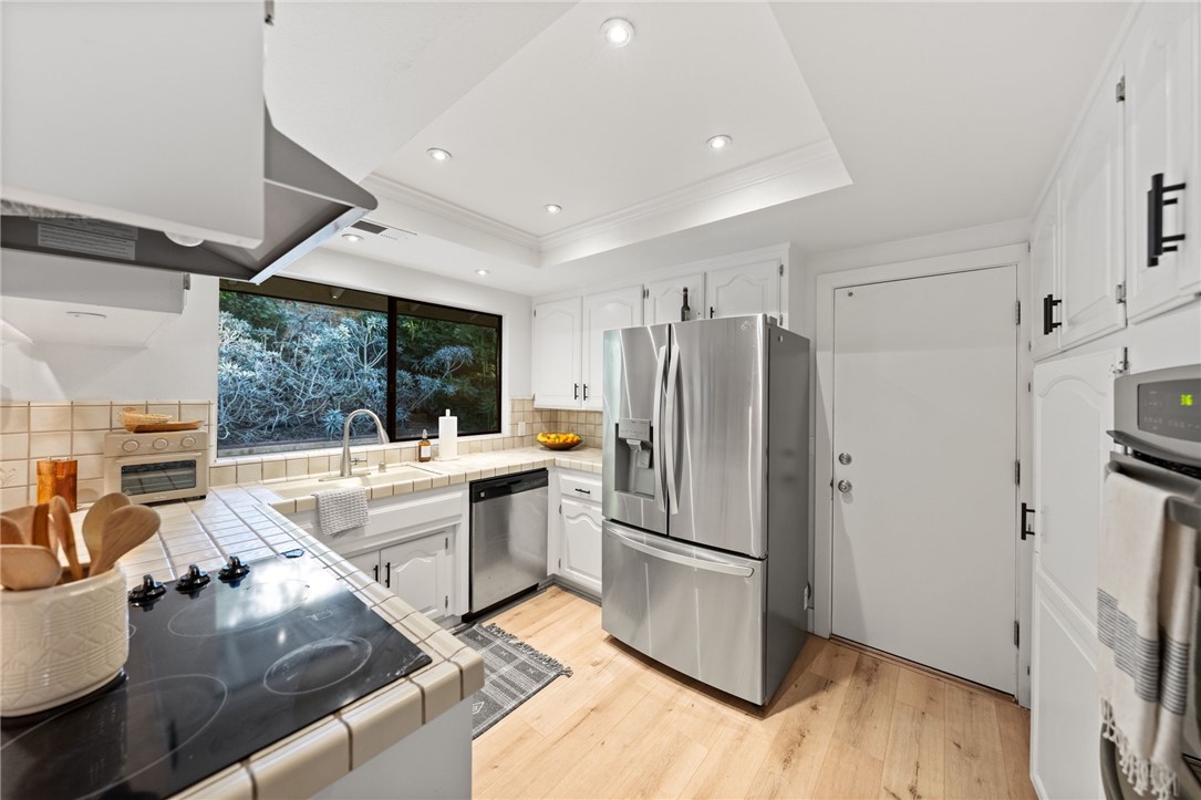 736 Del Valle Drive Fallbrook, CA 92028 - Photo 24 of 53 a kitchen with stainless steel appliances granite countertop a refrigerator and a stove