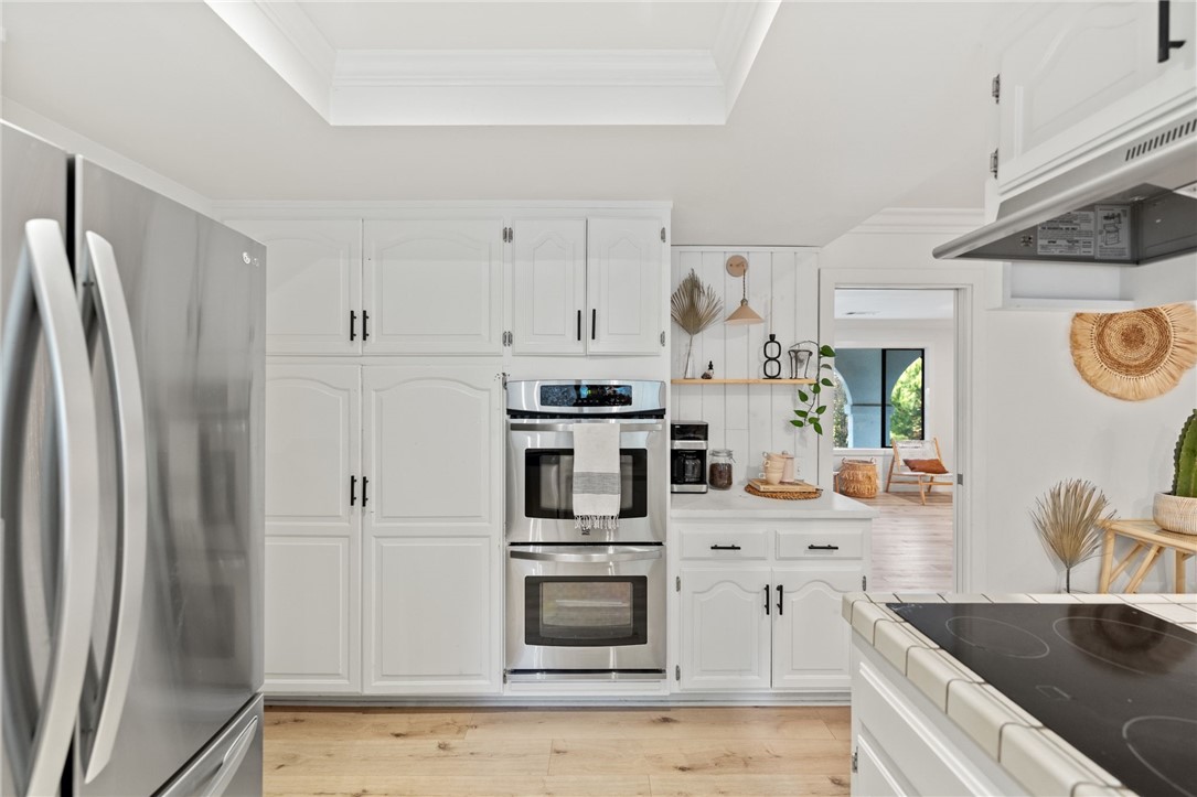 736 Del Valle Drive Fallbrook, CA 92028 - Photo 27 of 53 a kitchen with stainless steel appliances granite countertop a refrigerator and a sink