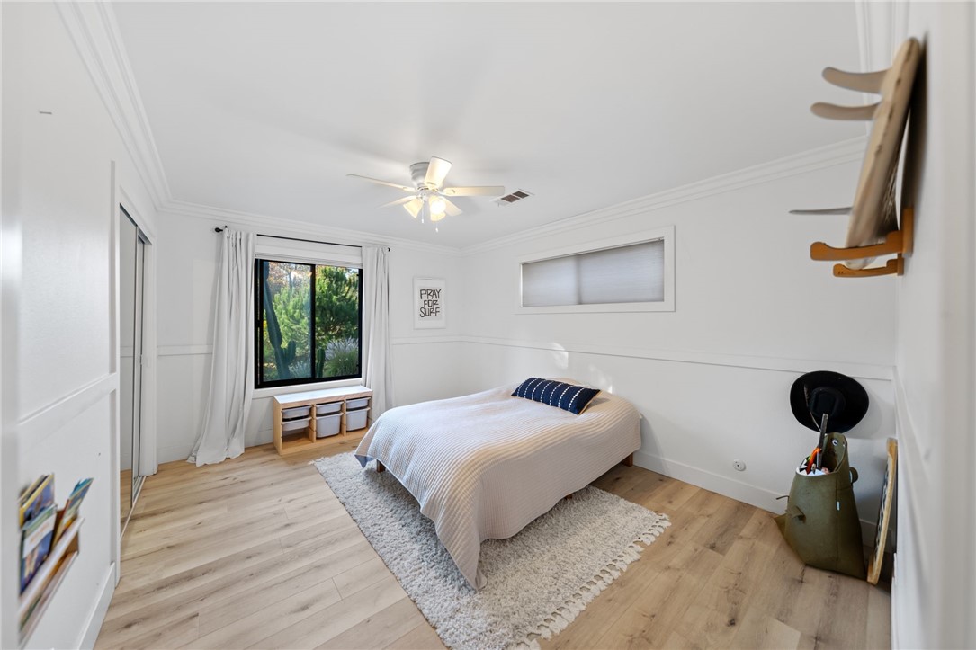 736 Del Valle Drive Fallbrook, CA 92028 - Photo 29 of 53 a bedroom with a bed and a chandelier