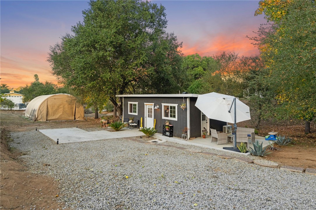 736 Del Valle Drive Fallbrook, CA 92028 - Photo 39 of 53 a view of a house with a yard and large tree