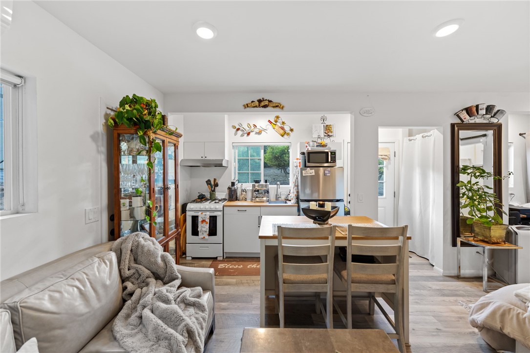 736 Del Valle Drive Fallbrook, CA 92028 - Photo 41 of 53 a living room with furniture a chandelier and a dining table