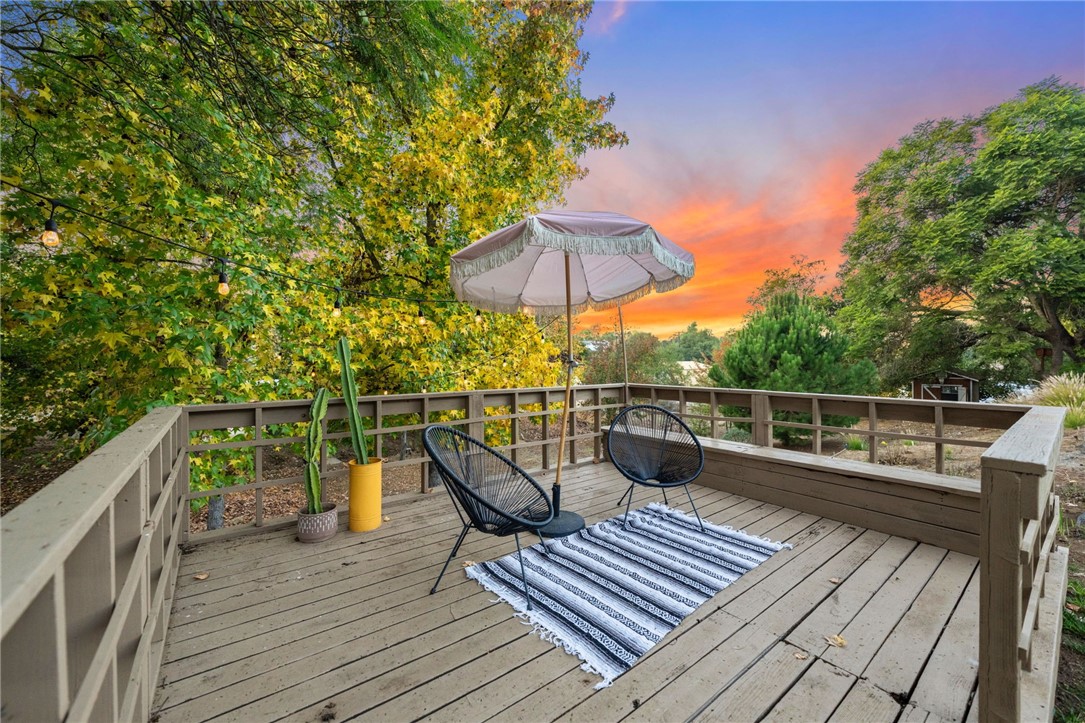 736 Del Valle Drive Fallbrook, CA 92028 - Photo 9 of 53 a view of a roof deck with table and wooden floor