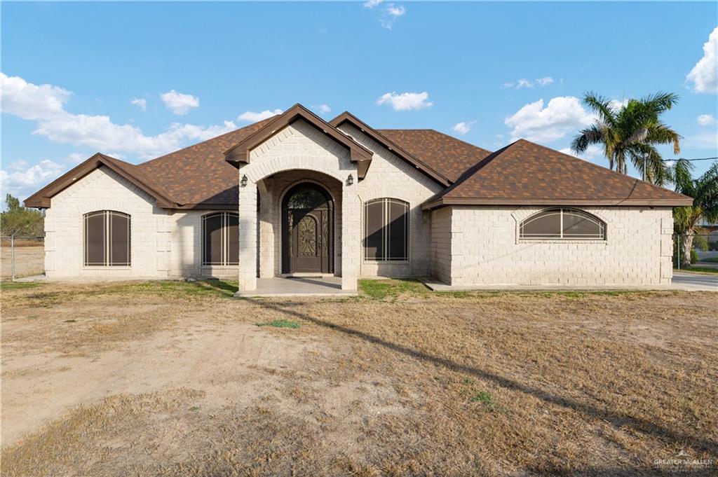 704 Goodwin Acres Road Mission, TX 78574 - Photo 1 of 26 a view of a house with a yard and garage