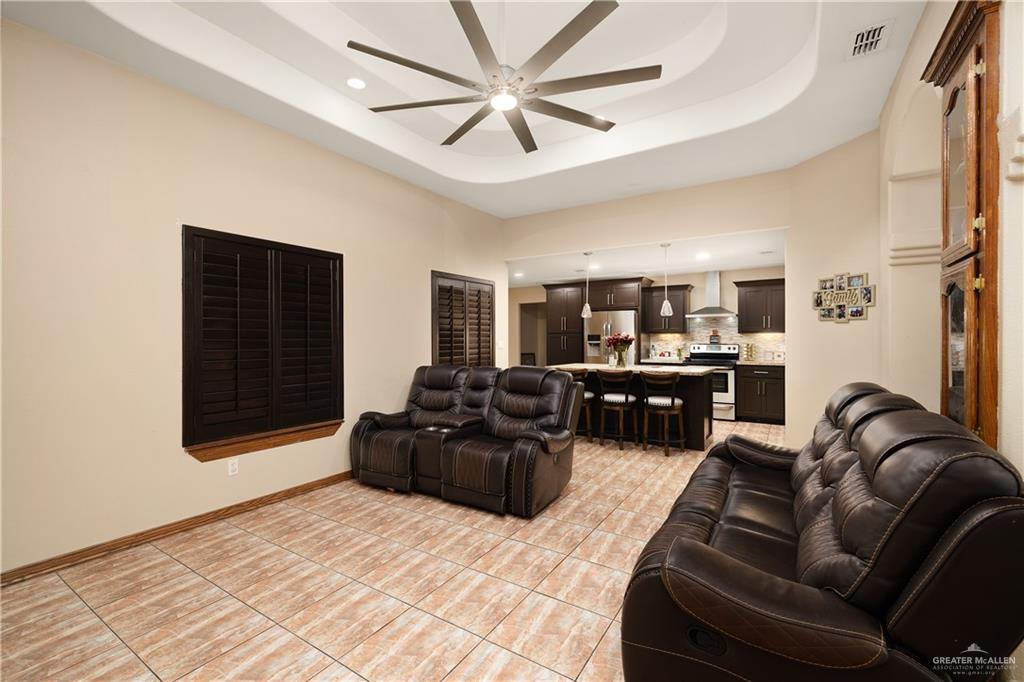 704 Goodwin Acres Road Mission, TX 78574 - Photo 6 of 26 a living room with furniture ceiling fan and a rug