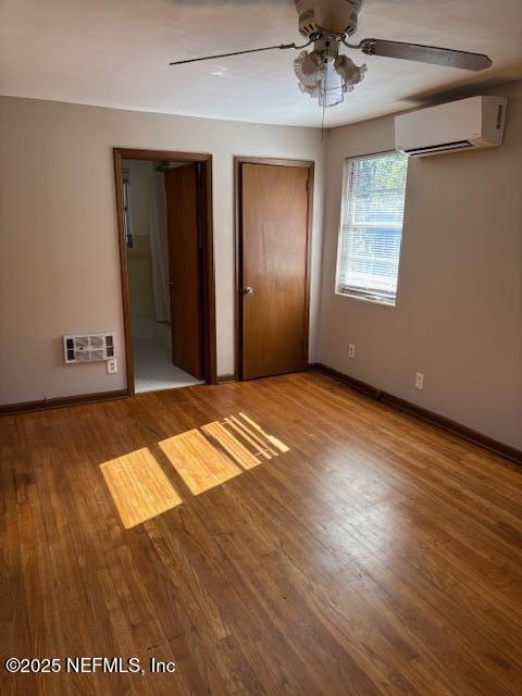 2898 Olga Place, Unit 3 Jacksonville, FL 32205 - Photo 6 of 8 an empty room with wooden floor closet and windows