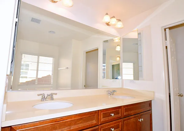 a bathroom with a sink a vanity and a mirror