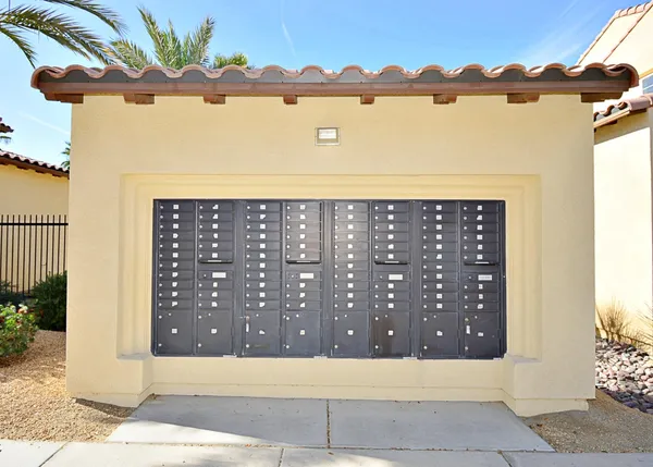 a view of a garden with a building in the background