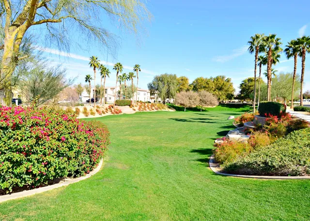 a swimming pool with outdoor seating and yard