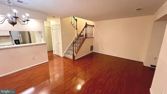 a view of an entryway with wooden floor