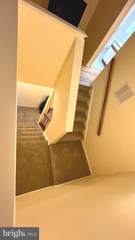 a bathroom with a sink toilet and a mirror