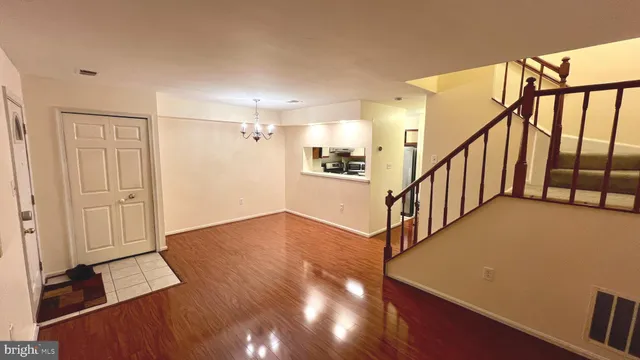 a view of entryway with wooden floor