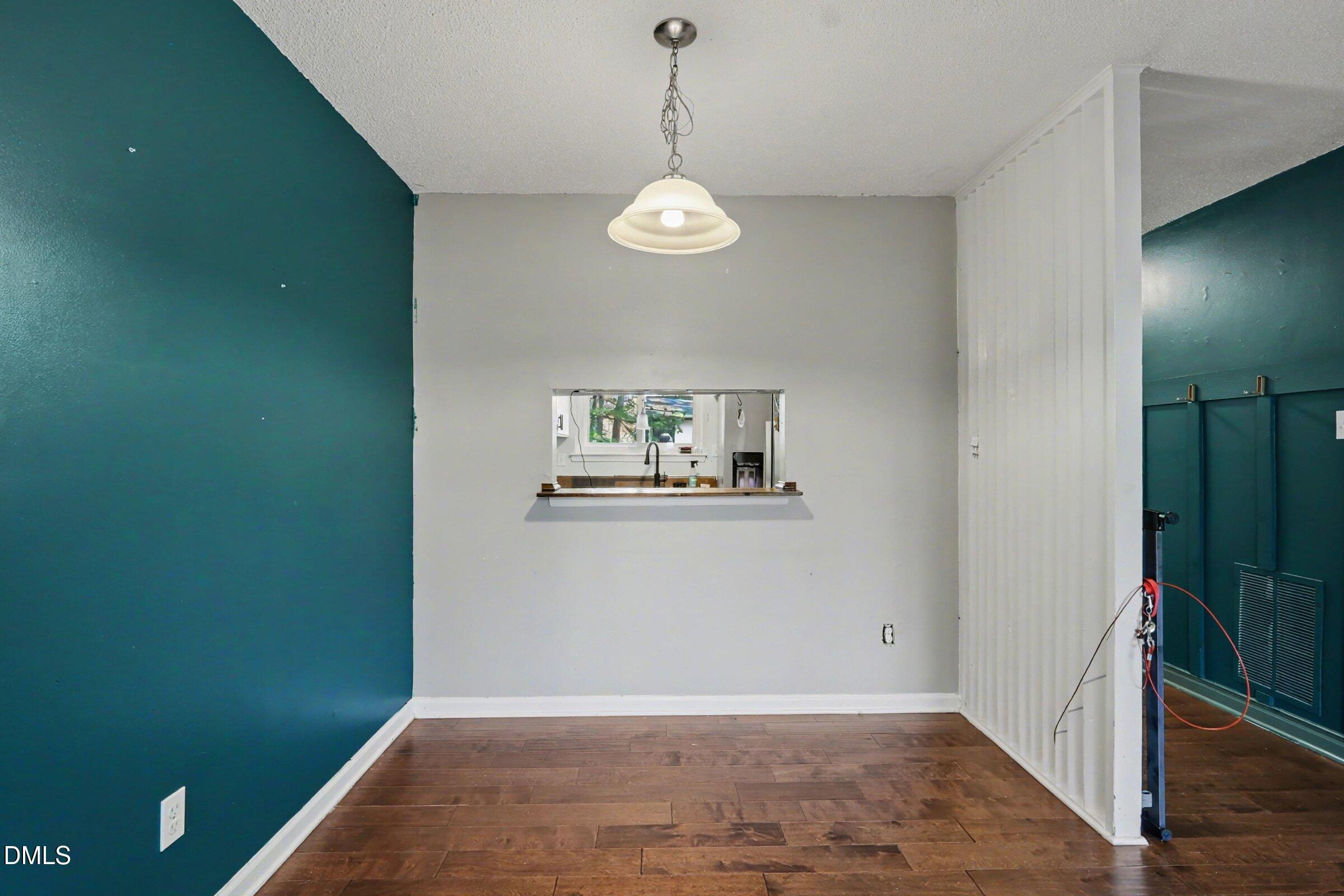 4271 Lake Ridge Drive Raleigh, NC 27604 - Photo 12 of 36 a view of a room with wooden floor and window
