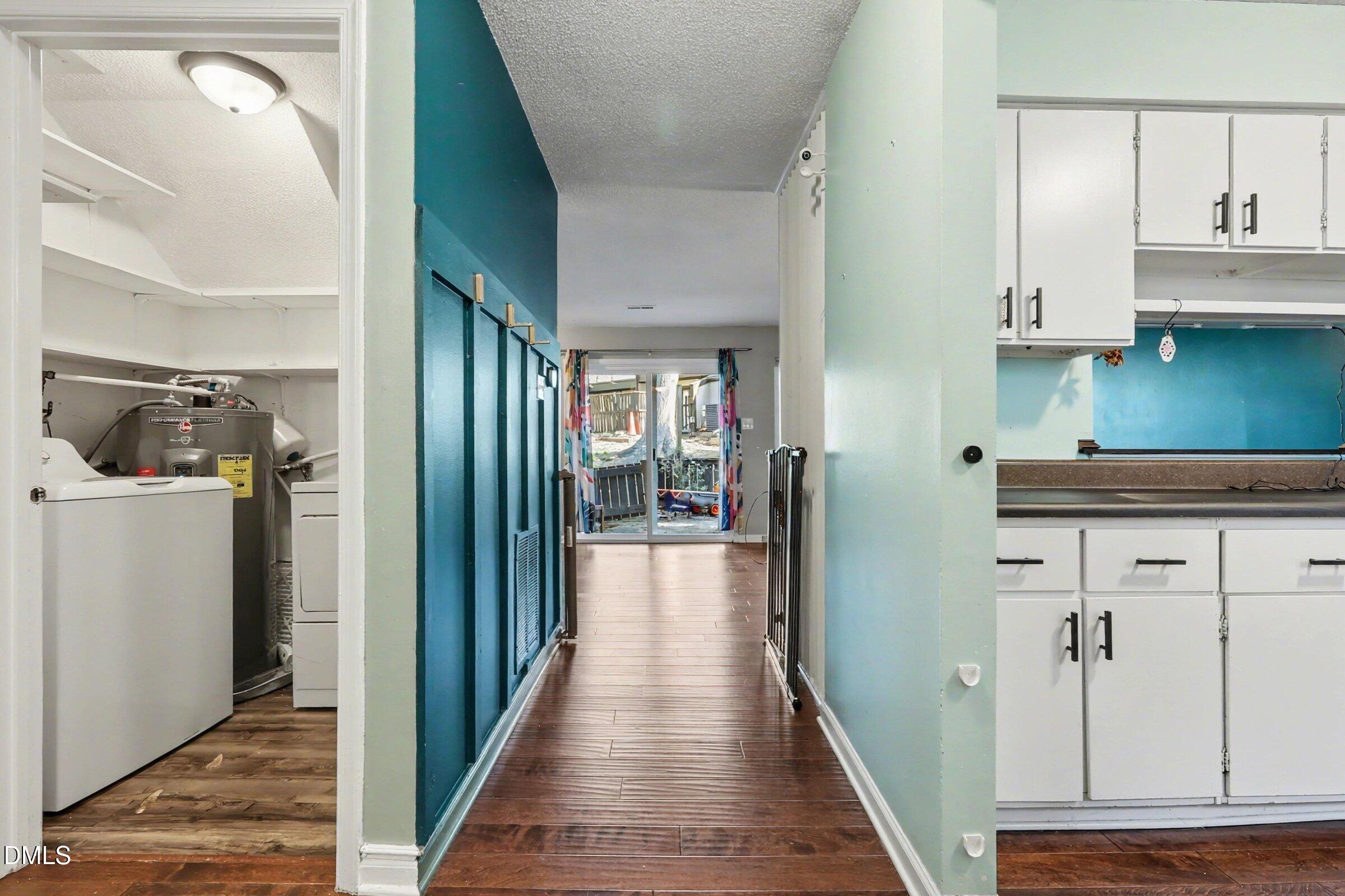 4271 Lake Ridge Drive Raleigh, NC 27604 - Photo 14 of 36 a view of a hallway with wooden floor and staircase