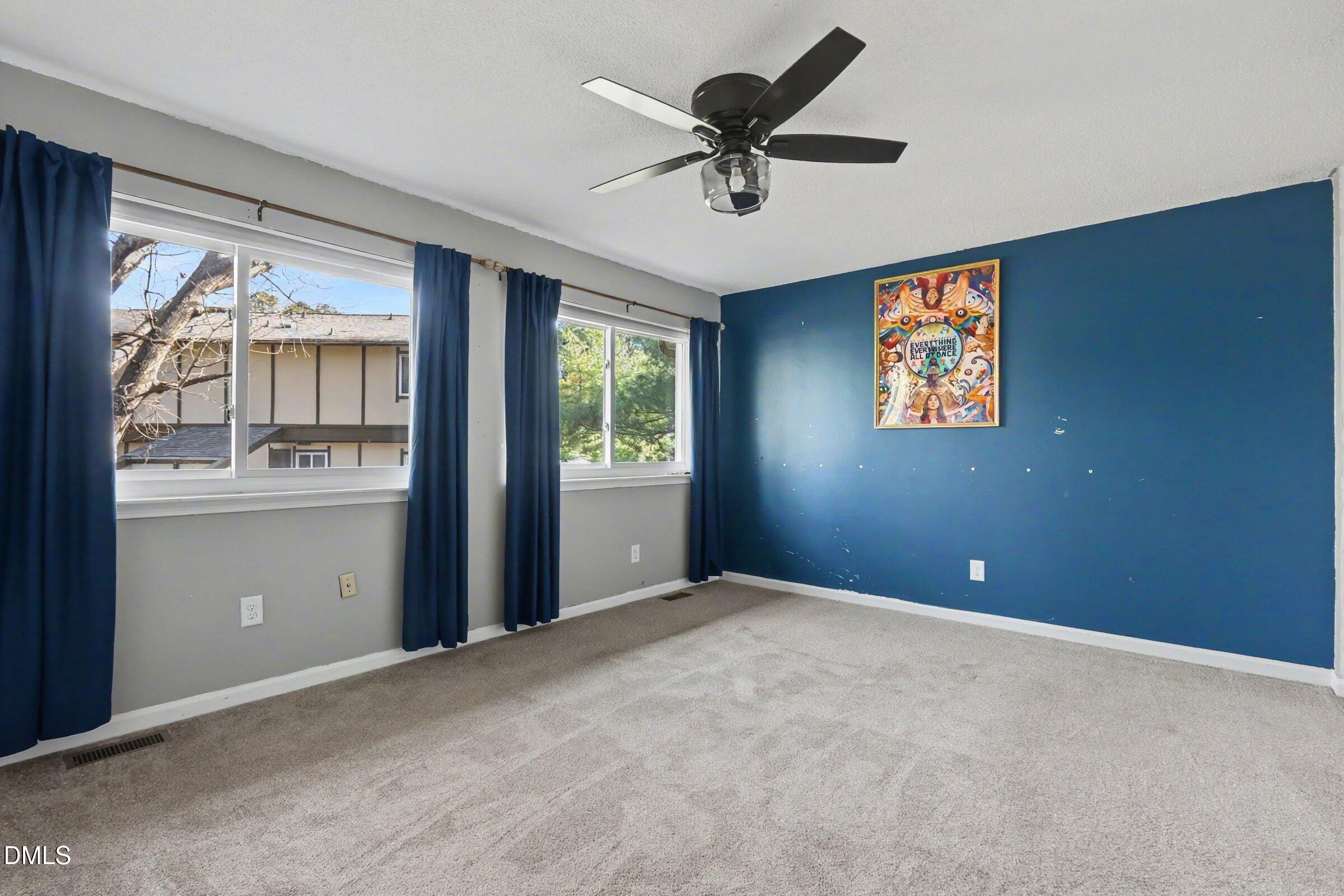 4271 Lake Ridge Drive Raleigh, NC 27604 - Photo 21 of 36 a view of an empty room with a window