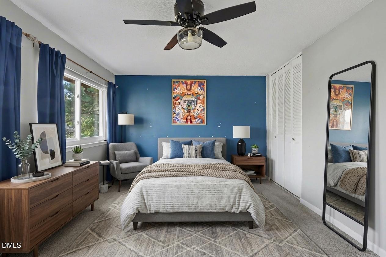 4271 Lake Ridge Drive Raleigh, NC 27604 - Photo 22 of 36 a bedroom with a bed couches and windows