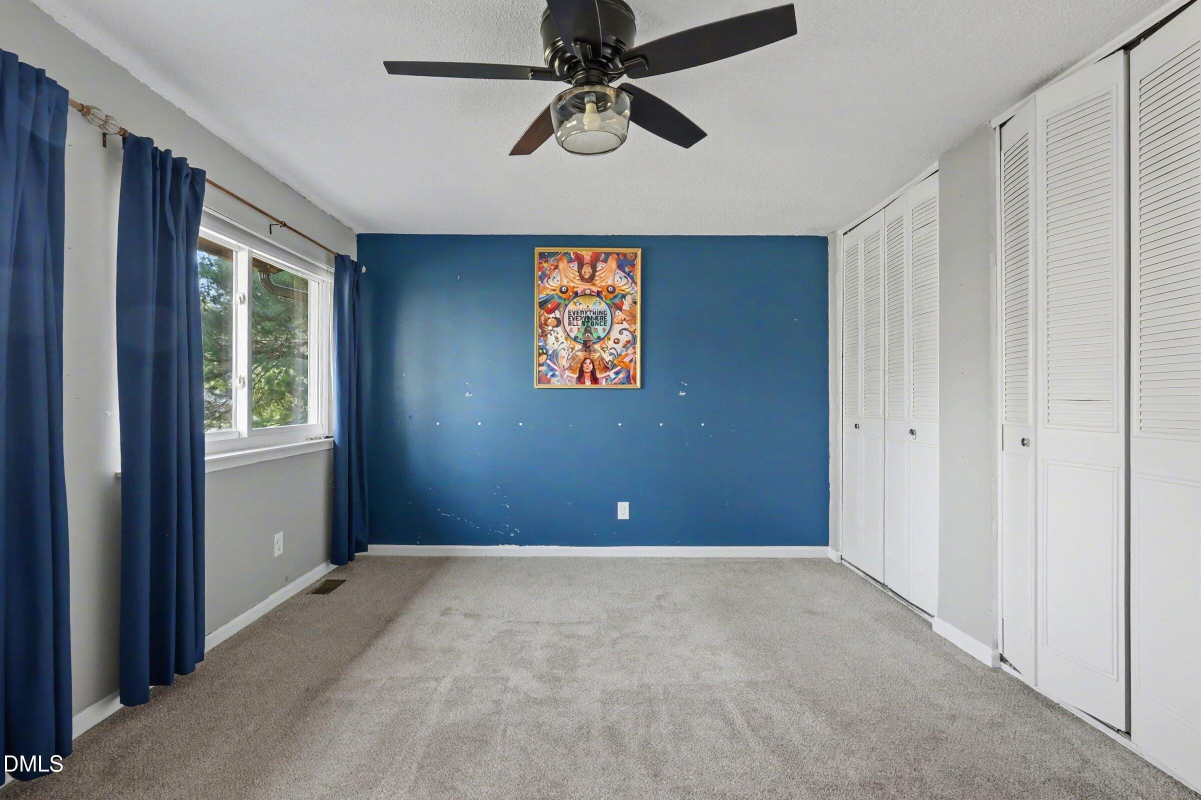 4271 Lake Ridge Drive Raleigh, NC 27604 - Photo 23 of 36 a view of an empty room with a window