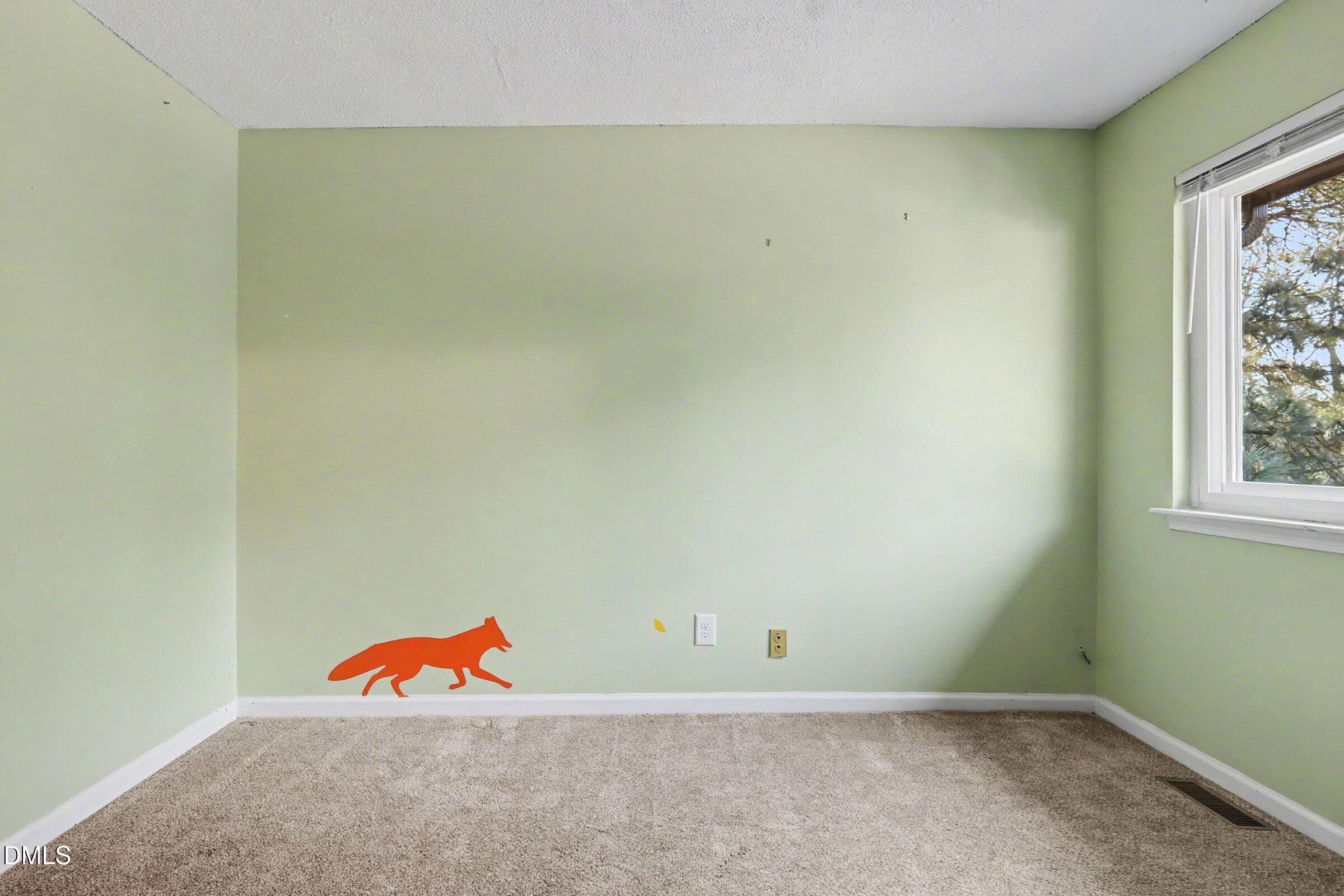 4271 Lake Ridge Drive Raleigh, NC 27604 - Photo 27 of 36 an empty room with a window