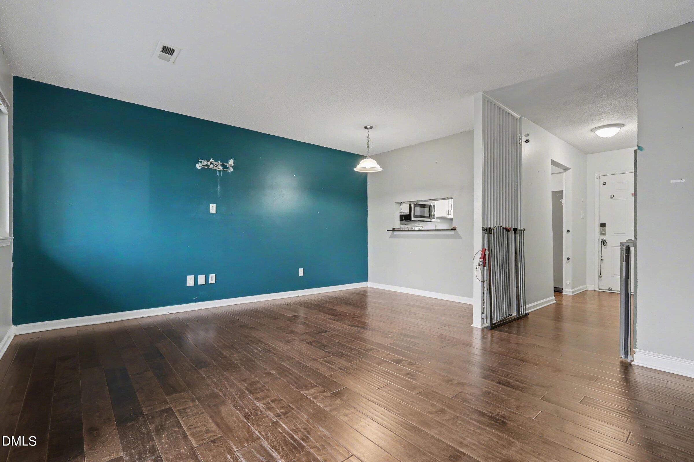 4271 Lake Ridge Drive Raleigh, NC 27604 - Photo 7 of 36 a view of empty room with wooden floor