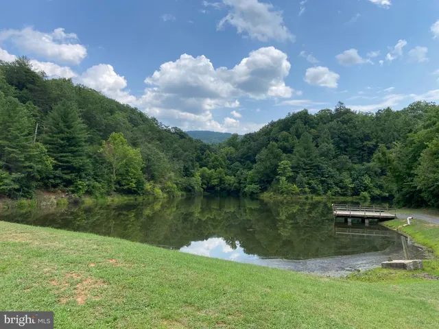 a view of a lake with a yard
