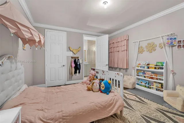 a bed room with a bed and a window