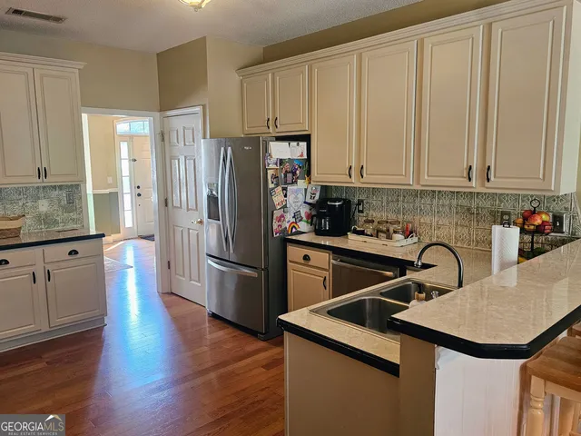 a living room with a couch and large windows