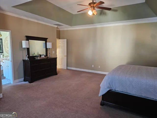 a bathroom with a sink mirror and vanity