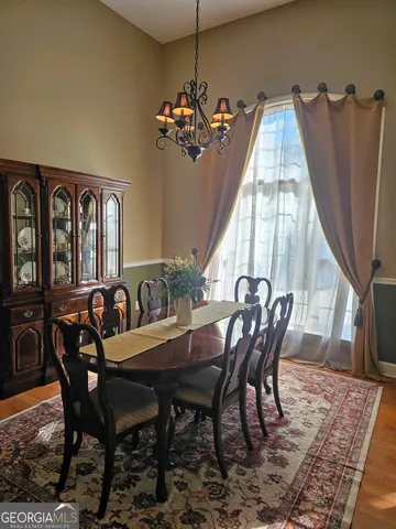 a kitchen with sink cabinets and wooden floor