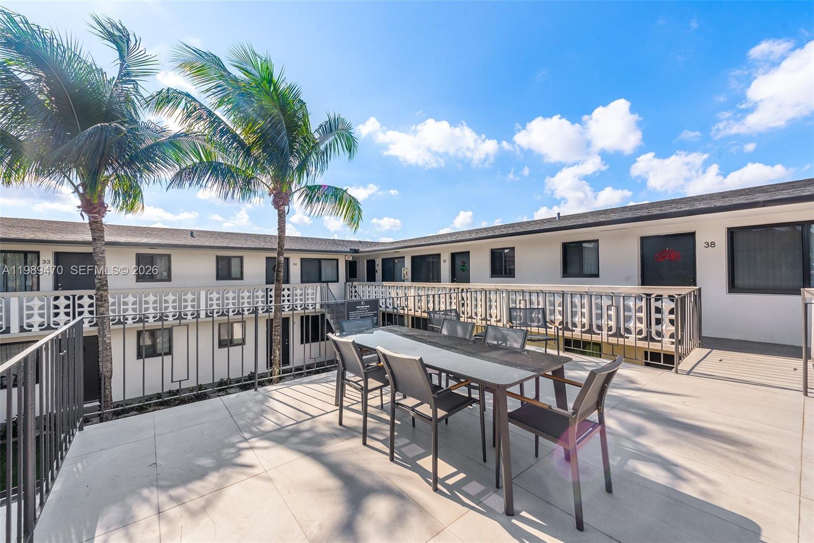 1330 West 29th Street, Unit 40 Hialeah, FL 33012 - Photo 11 of 12 a view of a house with patio and wooden floor
