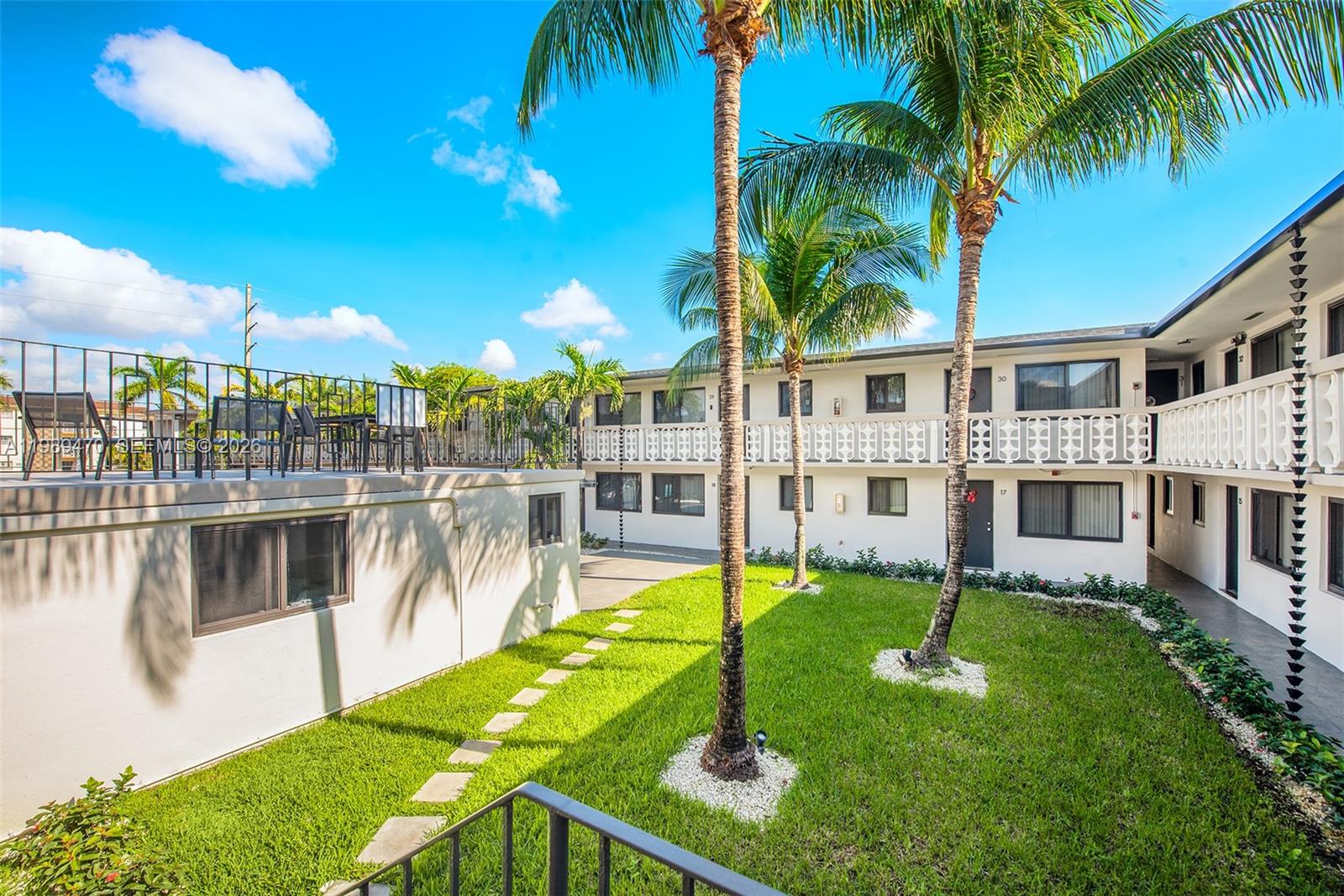1330 West 29th Street, Unit 40 Hialeah, FL 33012 - Photo 2 of 12 a view of a house with swimming pool and sitting area