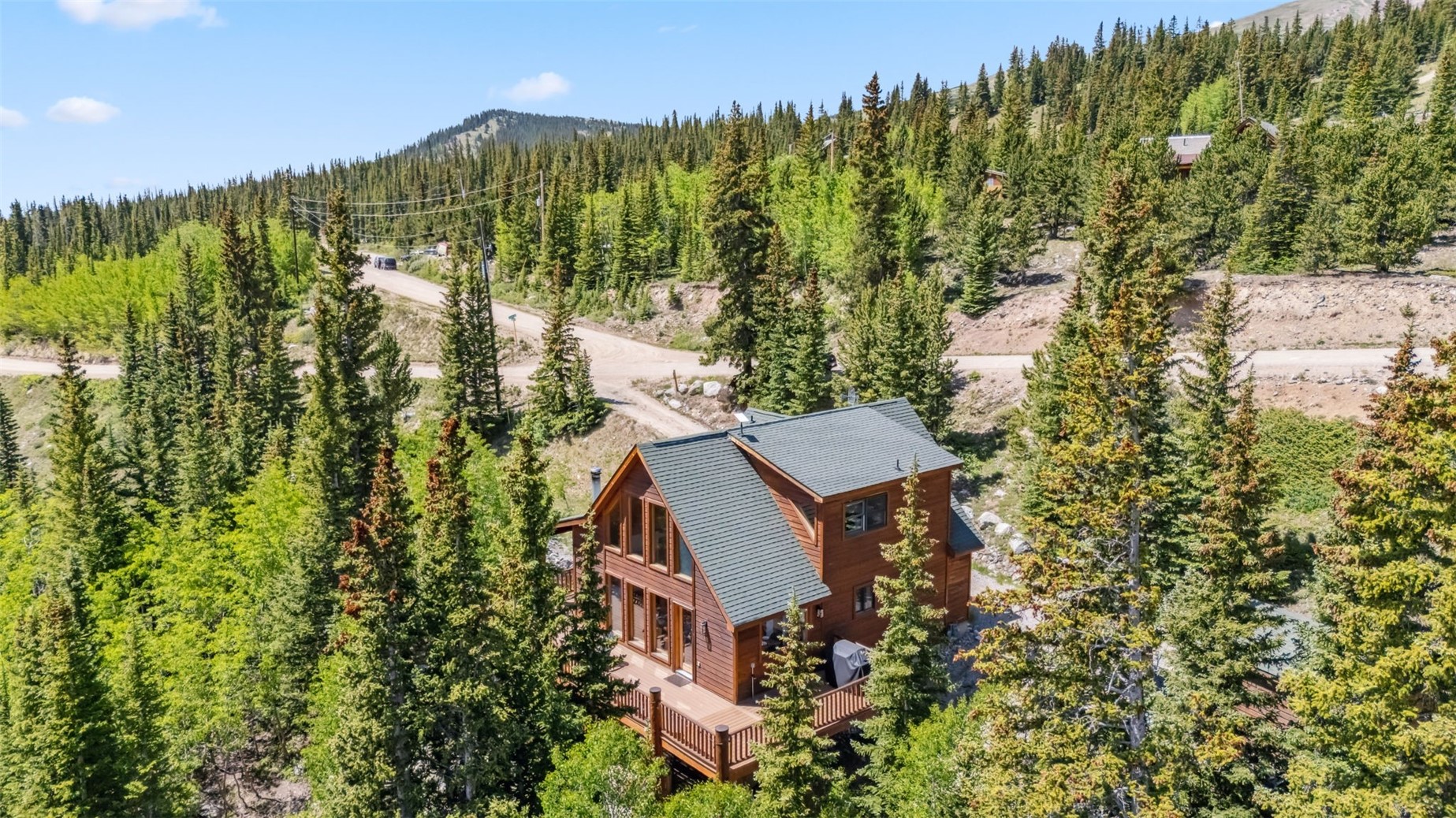 1375 Roberts Road Alma, CO 80420 - Photo 45 of 50 View from above of property featuring a forest and a mountainous background