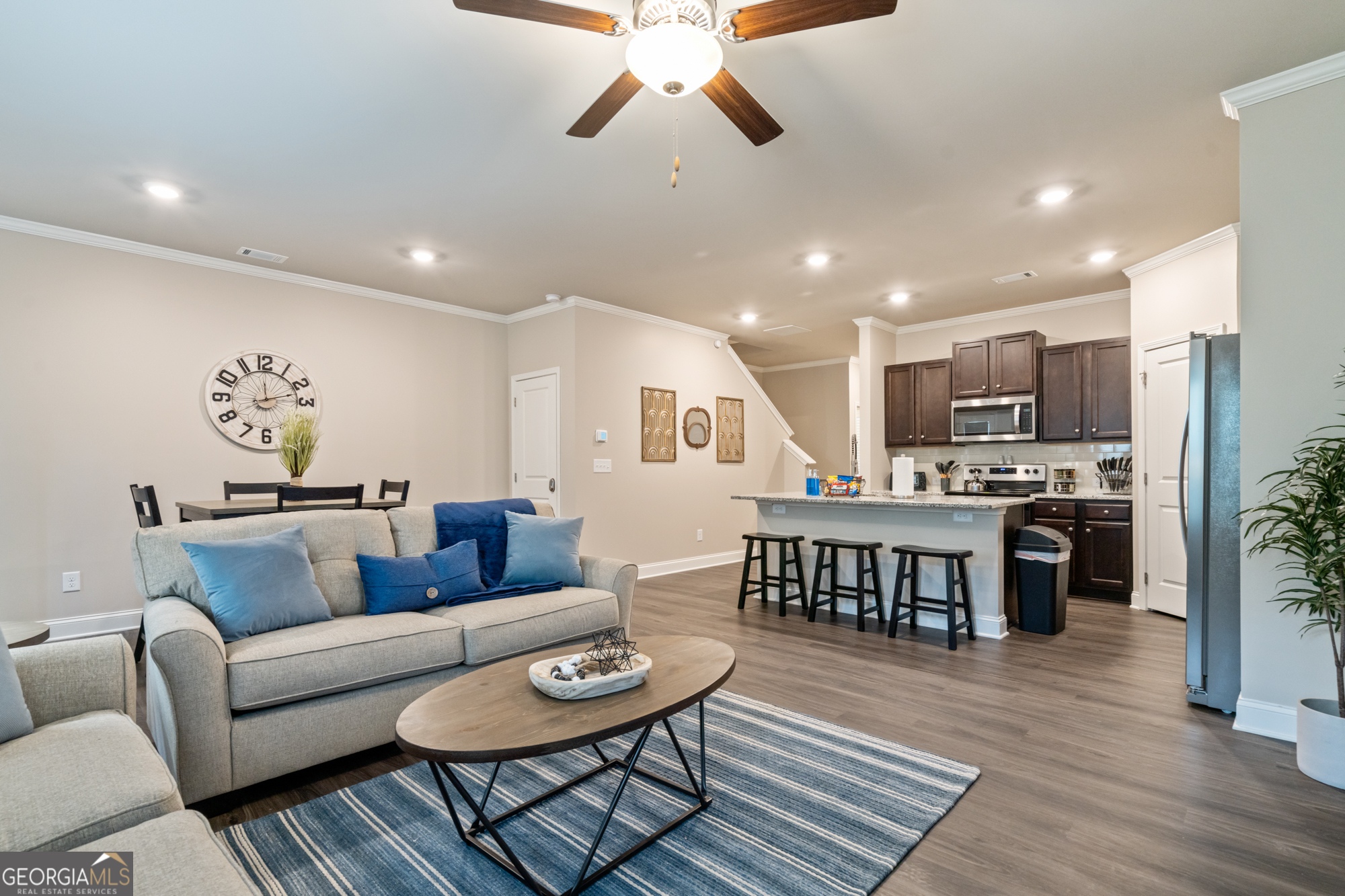 2029 Pinnacle Way Norcross, GA 30071 - Photo 13 of 30 a living room with furniture kitchen view and a wooden floor