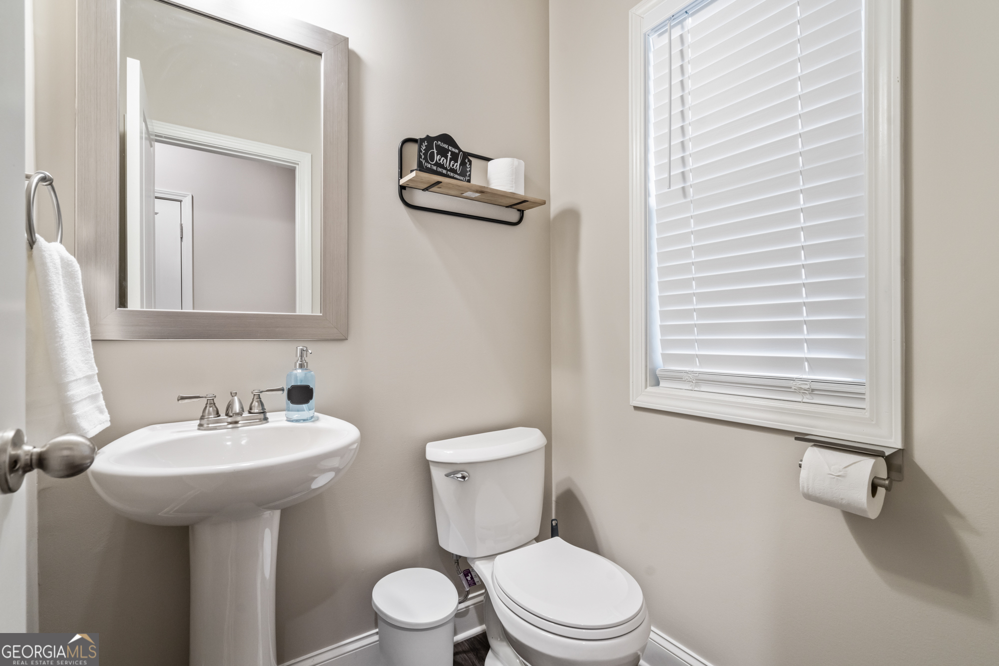2029 Pinnacle Way Norcross, GA 30071 - Photo 14 of 30 a bathroom with a sink a mirror and a toilet