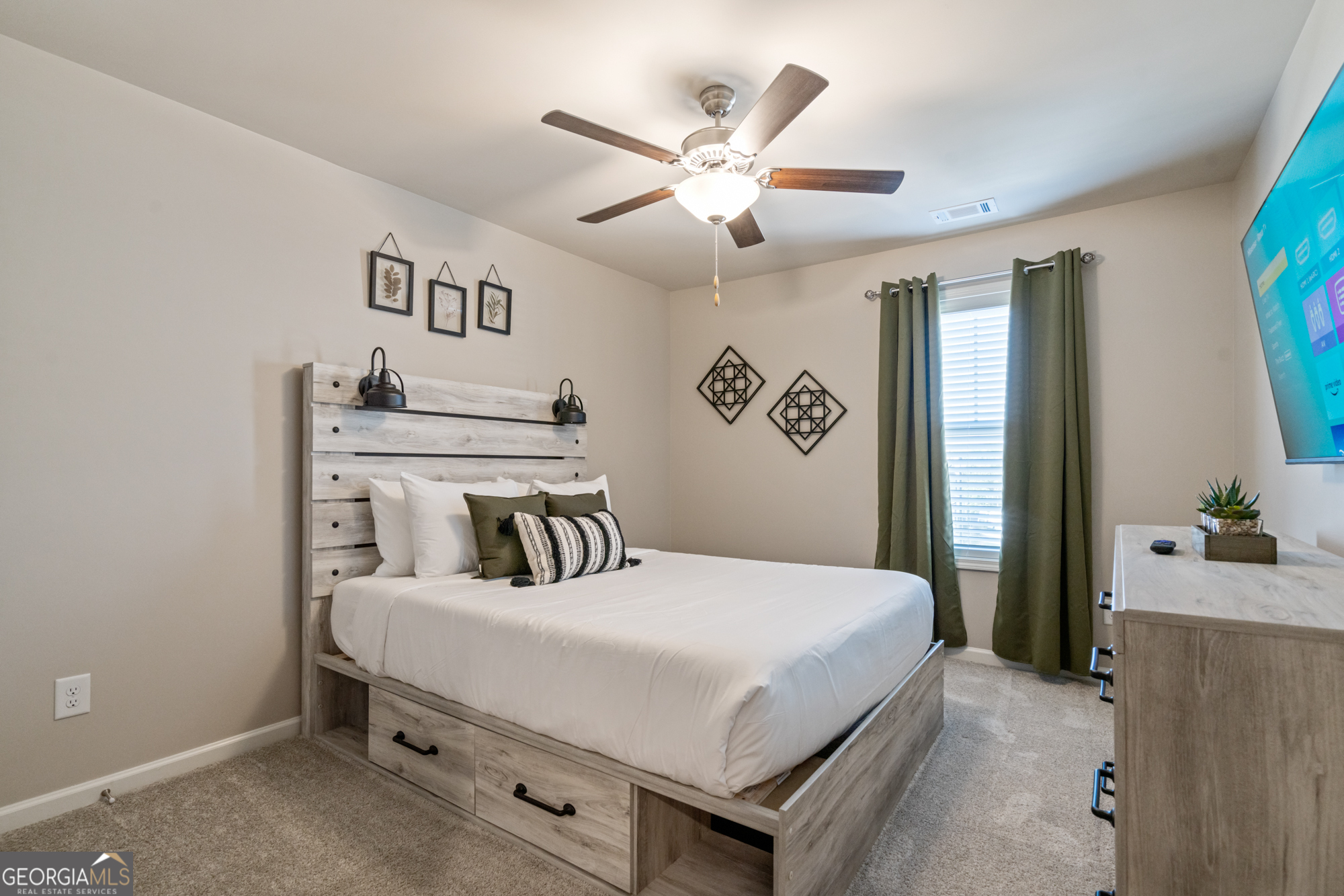 2029 Pinnacle Way Norcross, GA 30071 - Photo 20 of 30 a bedroom with a bed and a ceiling fan
