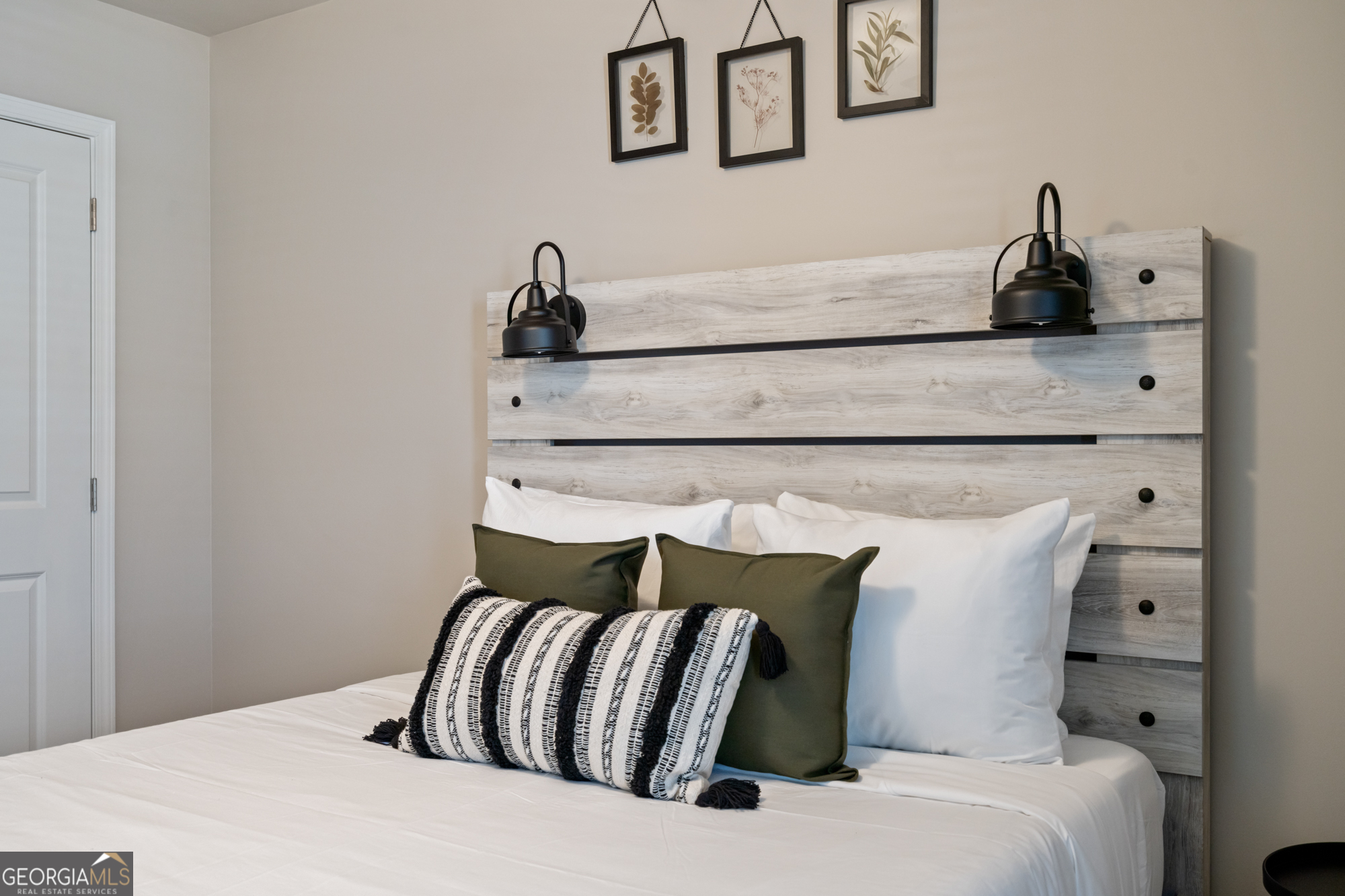 2029 Pinnacle Way Norcross, GA 30071 - Photo 22 of 30 a bedroom with a bed and lamp