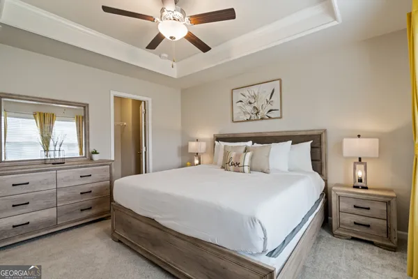 a bedroom with a bed and a dresser