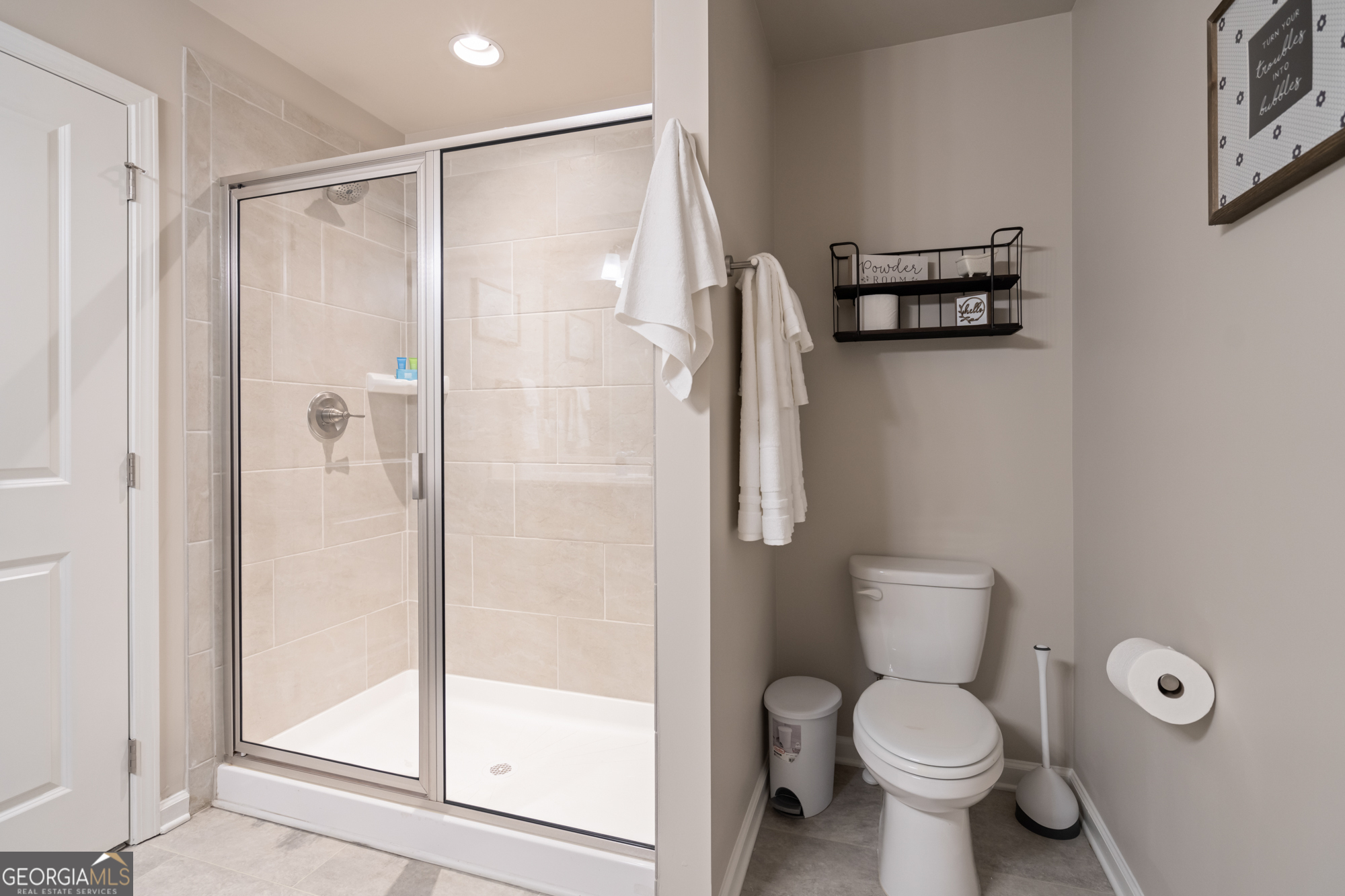 2029 Pinnacle Way Norcross, GA 30071 - Photo 27 of 30 a bathroom with a toilet and a shower