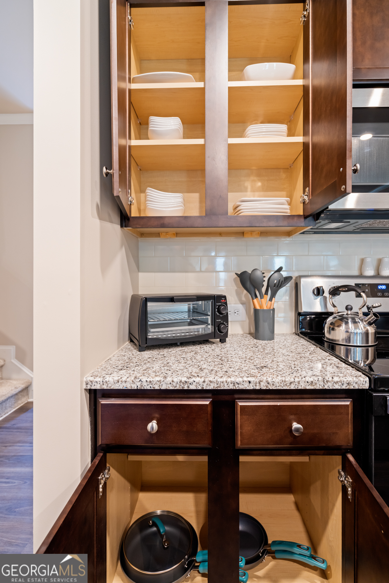 2029 Pinnacle Way Norcross, GA 30071 - Photo 7 of 30 a kitchen with granite countertop a sink a counter space and a window