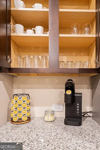 a close view of a fireplace and cabinets