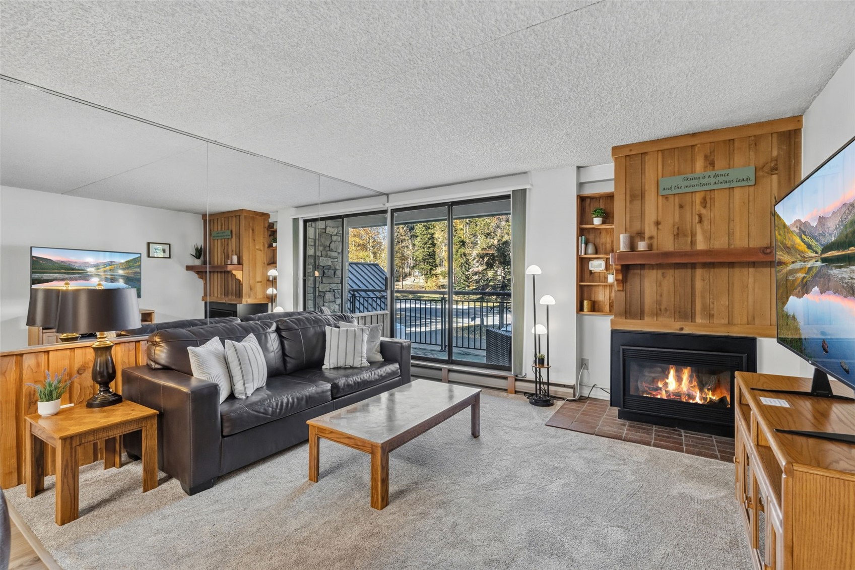 455 Village Road, Unit 215 Breckenridge, CO 80424 - Photo 7 of 35 Living area featuring a new gas fireplace