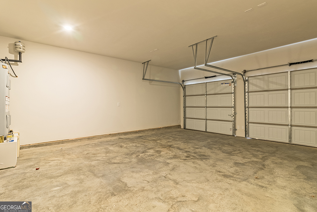 337 Jarrett Street Fairburn, GA 30213 - Photo 10 of 32 a view of a garage